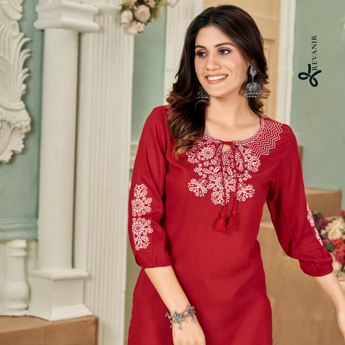shot of a proffesional indian woman wearing a breathable deep maroon Revanir short kurti.